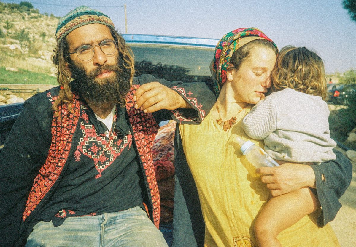 Portrait of two adults and a child