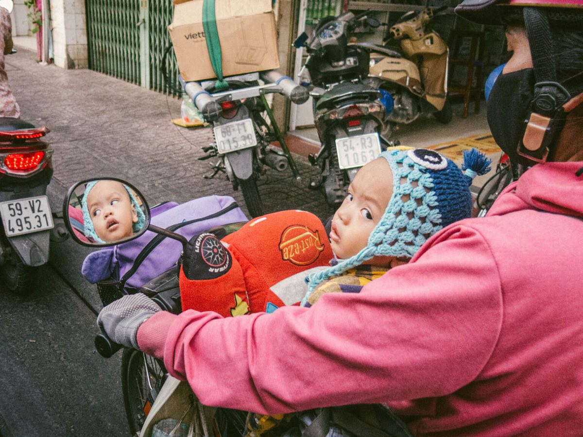 Child reflected in a wing mirror